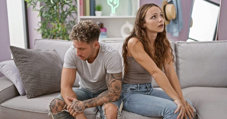 Couple having a serious conversation while considering regular STD testing and protecting their sexual health